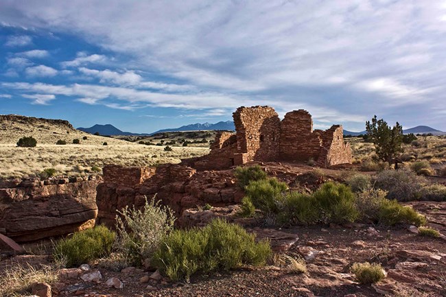 Low afternoon light illuminates the ruins of a prehistoric village