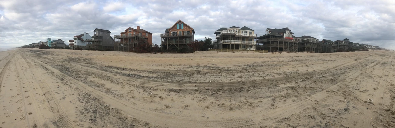 Cape Hatteras National Seashore Beach houses on stilts lined up along the beach