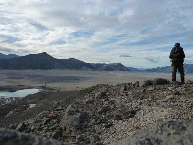 A hiker in the volcanic valley.