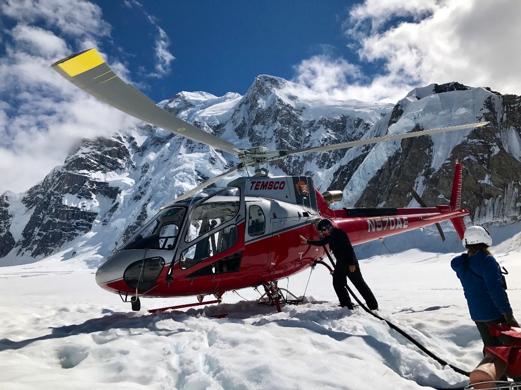 Helicopter pilot Andreas Hermansky fuels up at Basecamp