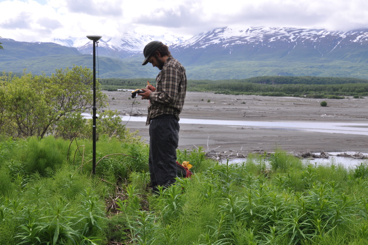 A man enters data into a handheld device