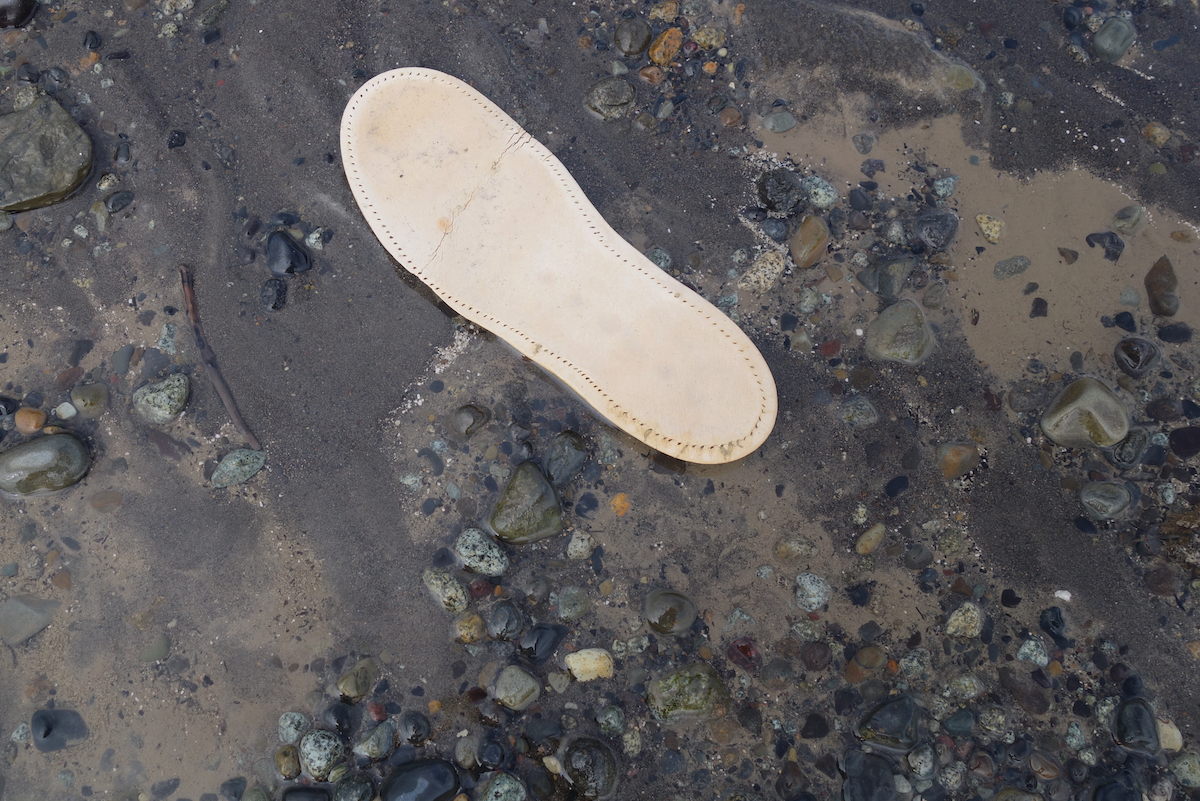 A shoe sole on the beach