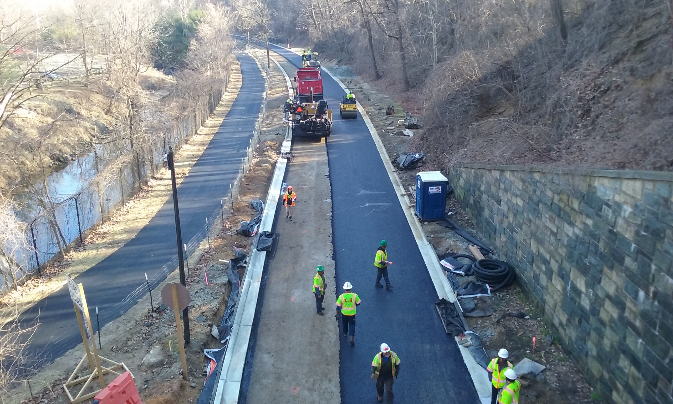 Crews pave new gravel base on Beach Drive (Segment 1).