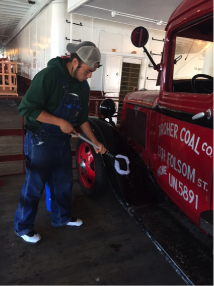 Aaron hard at work on one of our antique cars aboard Eureka antique cars, Eureka