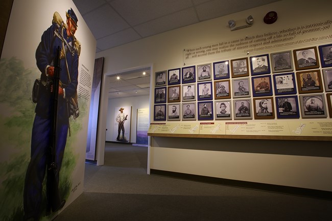Wall of faces exhibit space in the Visitor Contact Station Wall of faces exhibit space in the Visitor Contact Station