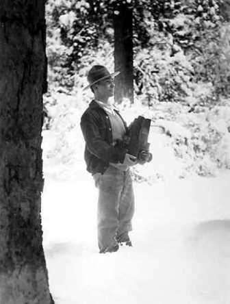 Historic image of George Wright standing in a snowdrift at Yosemite in 1929 Historic image of George Wright standing in a snowdrift at Yosemite in 1929