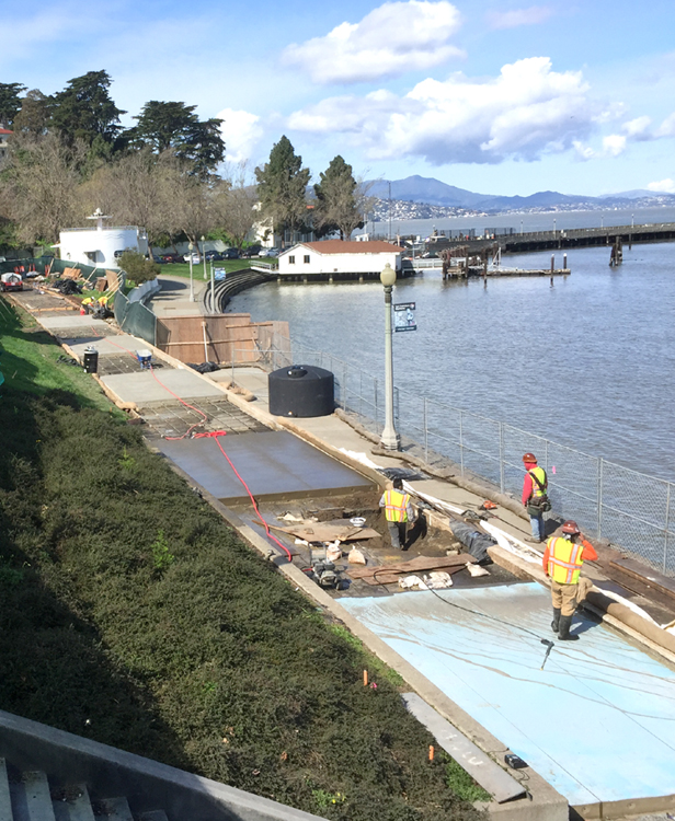 Concrete slabs poured and drying during the promenade construction project.