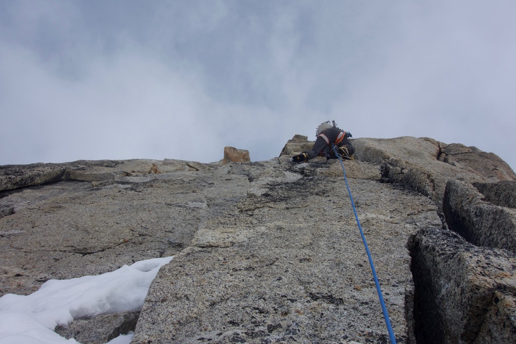 Rock pitch Climber scales a near vertical wall