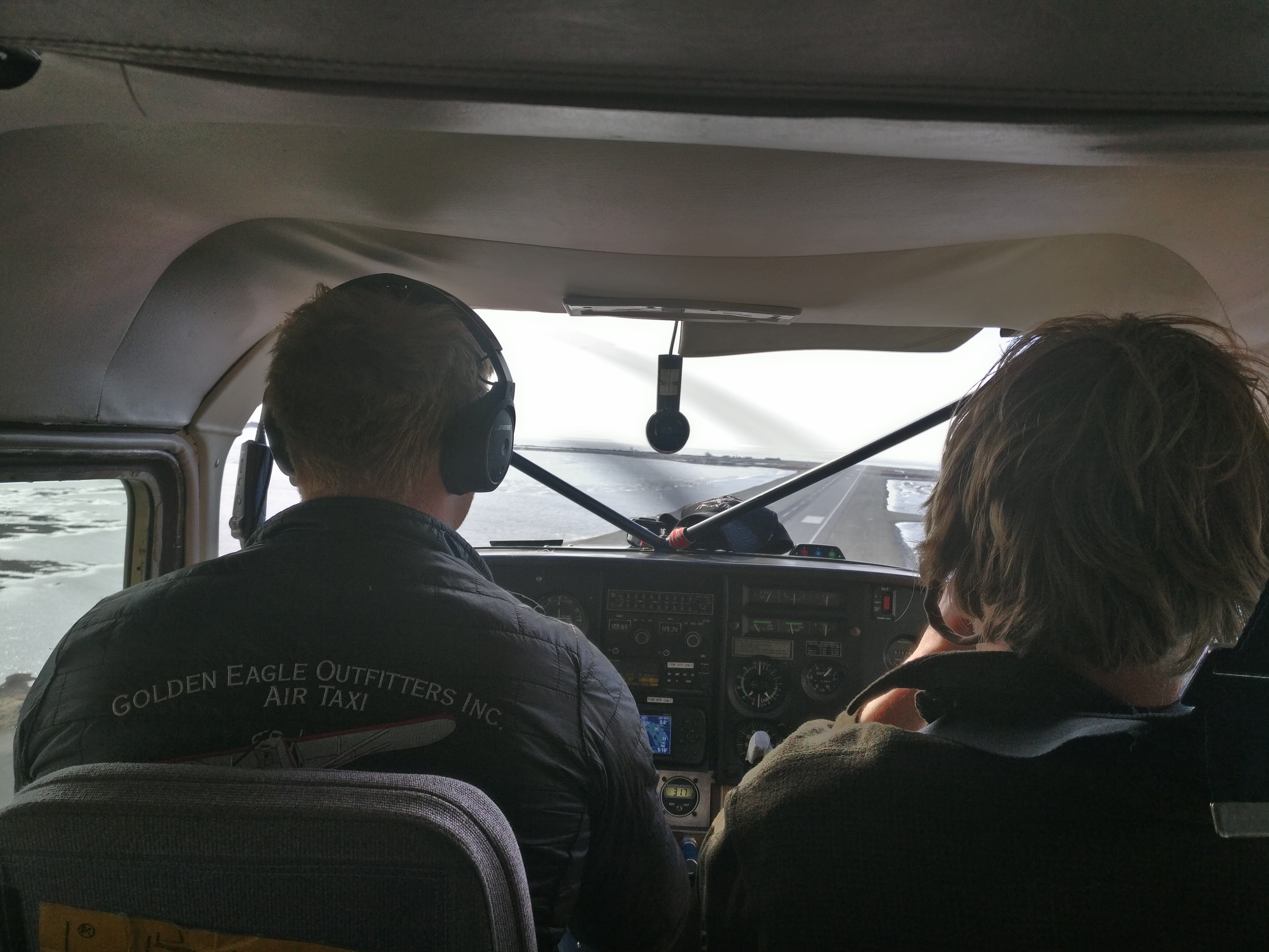 Safe Landing in Kotzebue A pilot and passenger in a small plane make their final approach to the runway of the airport in Kotzebue.