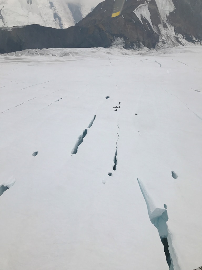 Kahiltna Glacier is striped with open crevasses in the late season