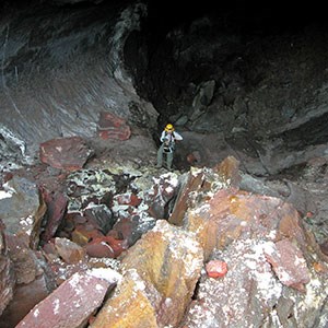 Breakdown blocks cover the floor in a lava tube. Breakdown blocks cover the floor in a lava tube.
