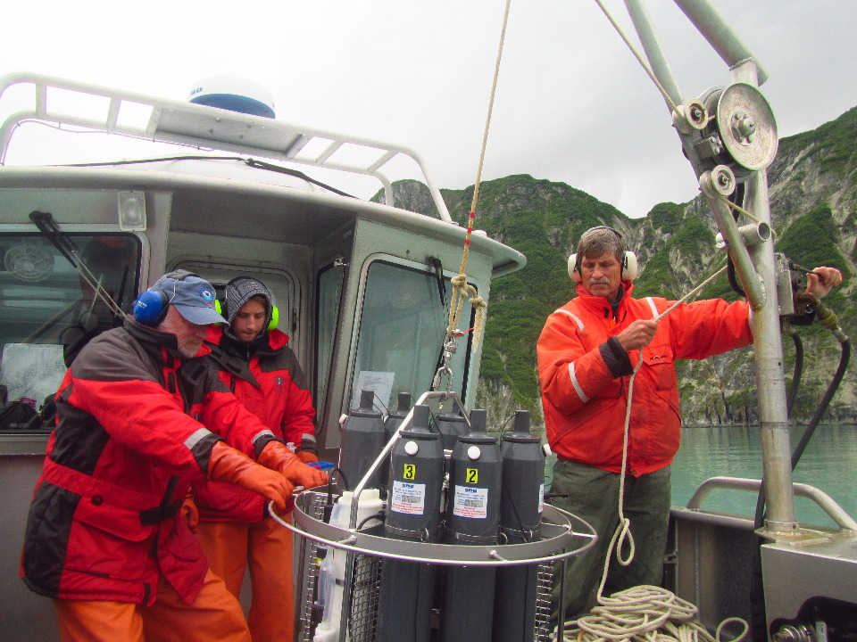 Three people lowering the CTD