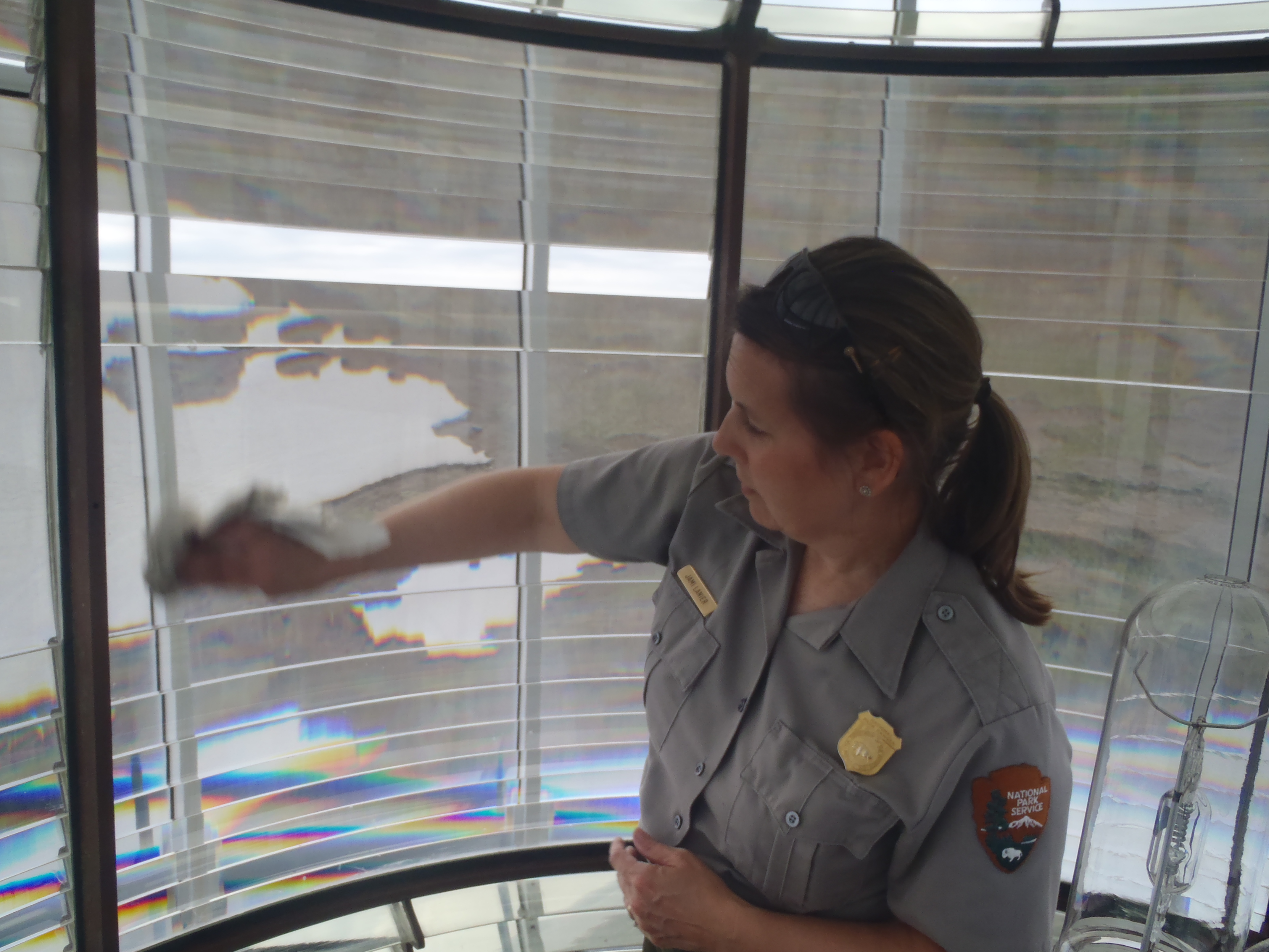 Jami Lanier cleaning Bodie Island Fresnel lens Jami Lanier cleaning Bodie Island Fresnel lens