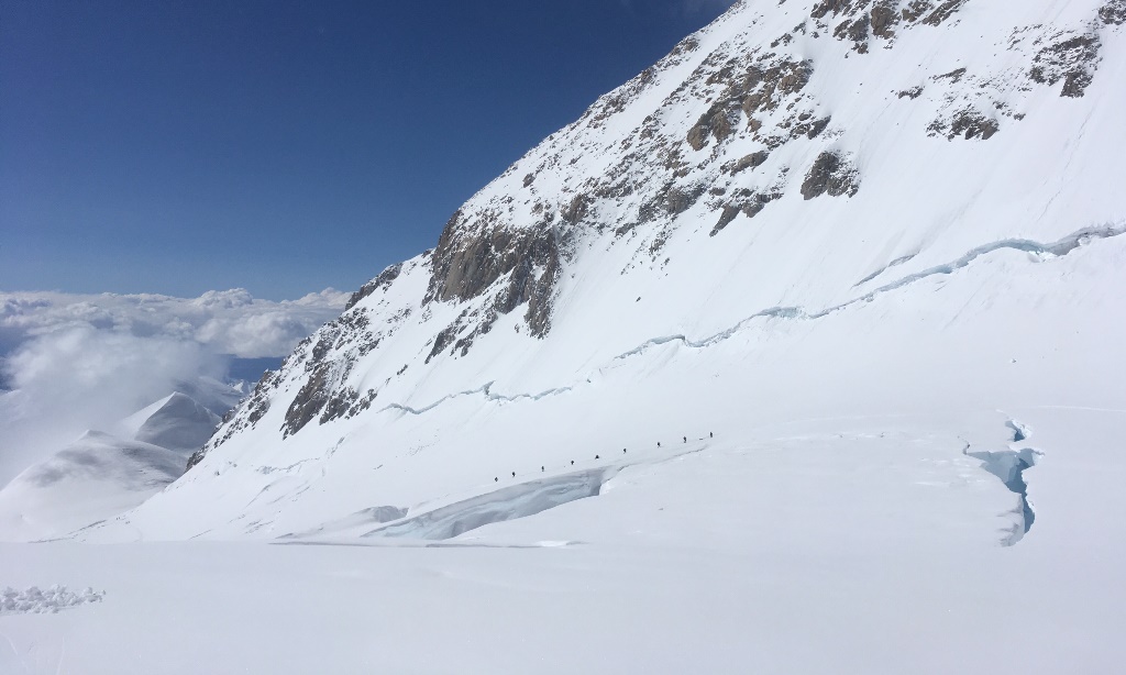 A team of roped climbers on the final approach to 14 camp