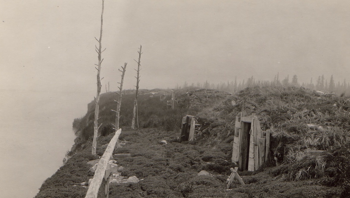 Large earth mounds form Native-style homes