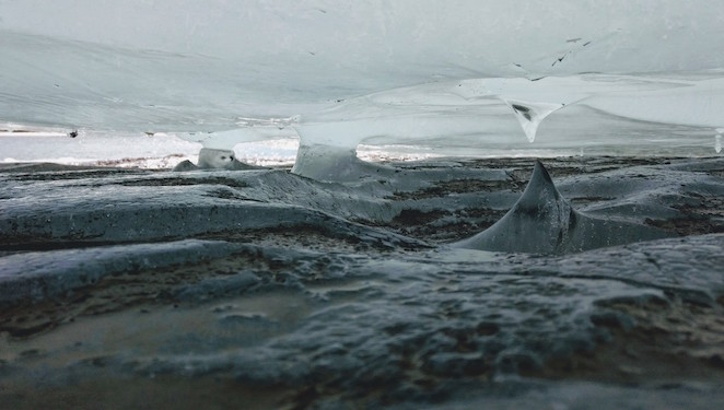 Cave ice A slab of ice sites inches above the mud, creating a miniature ice-cave
