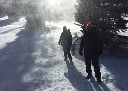 VIPs Bortolini and Williams volunteering in a snowstorm at Hidden Valley. (NPS Photo / Will Sunderland) Two volunteers wearing heavy winter clothes in a snowstorm.