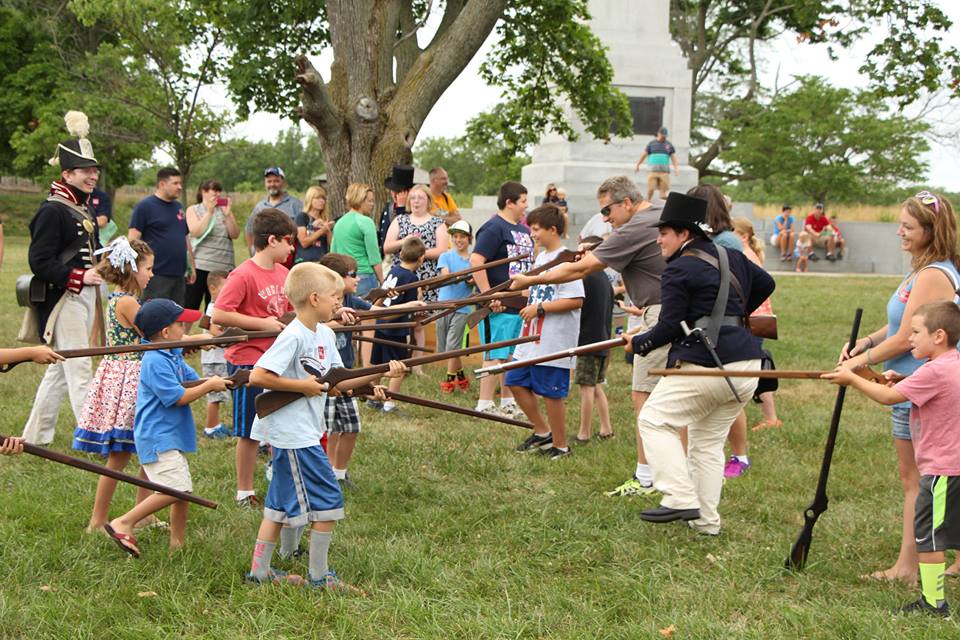 Children with toy muskets charging each other Children with toy muskets charging each other