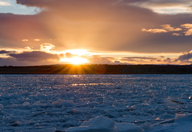 Ice formations blanket the Nakek river A blanket of broken ice sheets cover the water surface