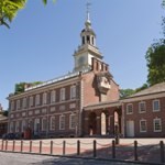 Independence Hall with a blue sky in the background.