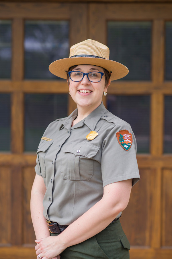 Lauren Gurniewicz A smiling woman in a National Park Service uniform
