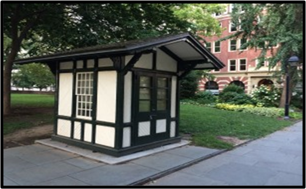 Guardhouse in Washington Square A small shed like structure with green trim and beige walls.