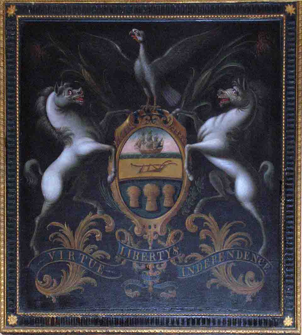 PA coat of arms with a shield crested by an American bald eagle, flanked by horses, and adorned with a ship; a clay-red plough, and three golden sheaves of wheat. An olive branch and cornstalk cross limbs beneath. "Virtue, Liberty and Independence"
