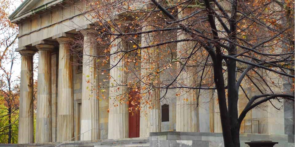 Color photo showing exterior view of the north facade of the Second Bank featuring eight marble columns topped by a triangular pediment.