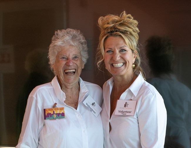 Two Volunteers Smiling