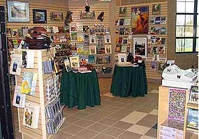 inside a store with racks and shelves full of products