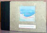 a artist made book sitting on it's edge with a map of the Indiana Dunes Naitonal Lakeshore's shoreline on the cover
