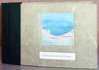 a artist made book sitting on it's edge with a map of the Indiana Dunes Naitonal Lakeshore's shoreline on the cover