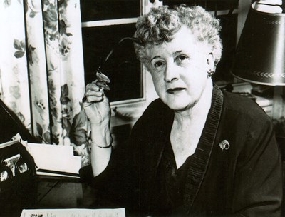 Photo of Dorthy Buell sitting at desk