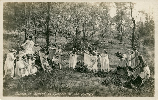Historic sepia photograph from 1913 of a masque performance in the Indiana Dunes.
