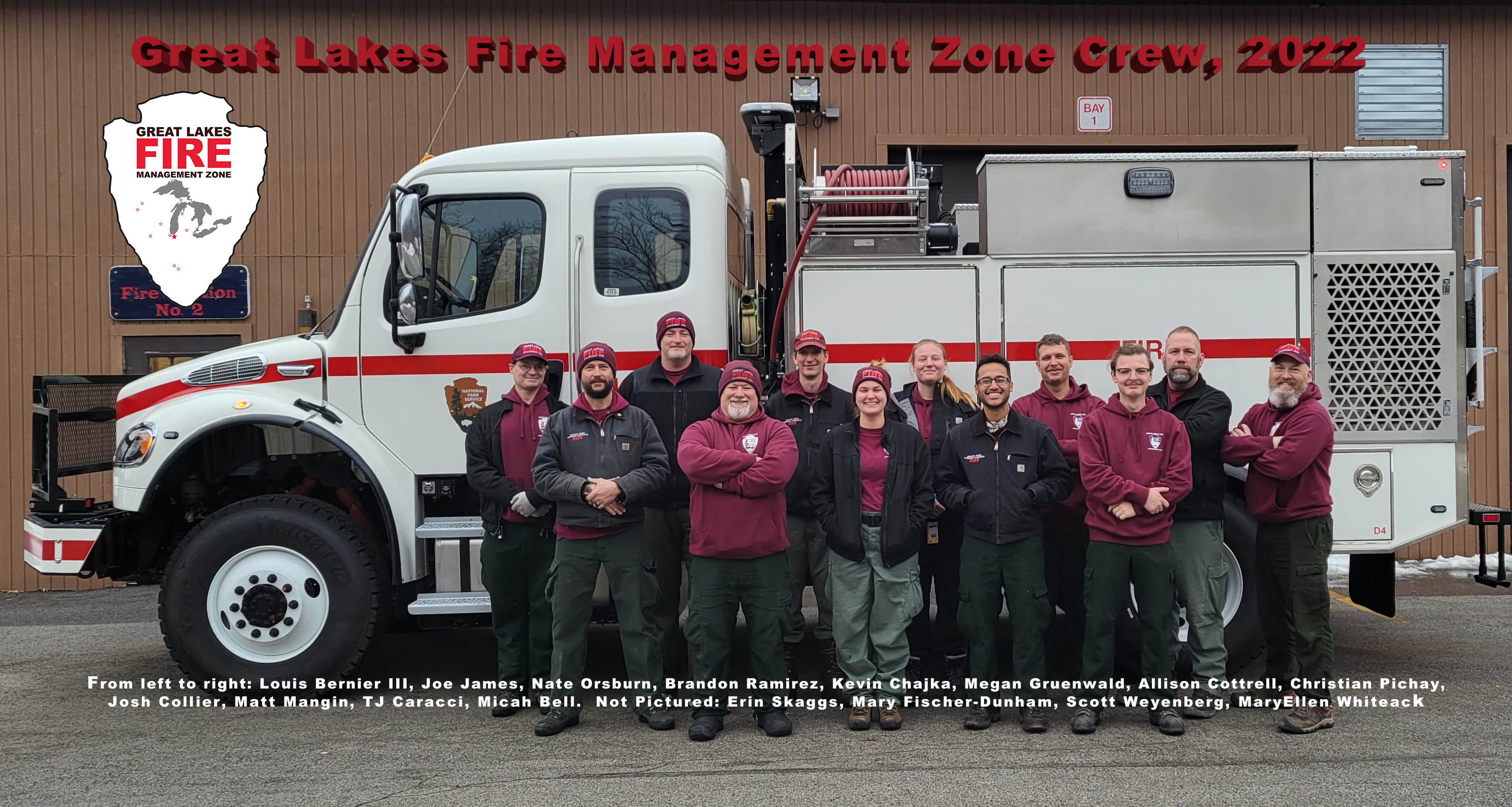 firefighters in maroon shirts and green pants pose for a group photo in front of a white NPS fire engine