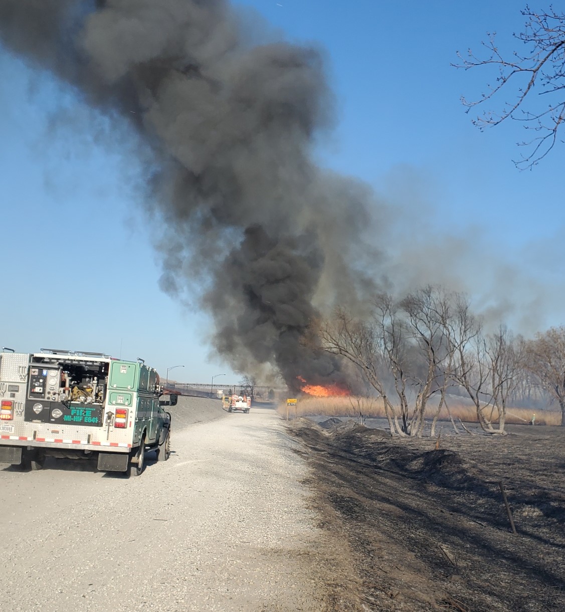 A US Forest Service wildland fire engine assists NPS and Burns Harbor Fire firefighters late Friday afternoon on a wildland fire in the Port of Indiana. NPS Photo/Ramirez.