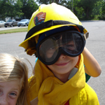 Kid wearing wildland fire clothing