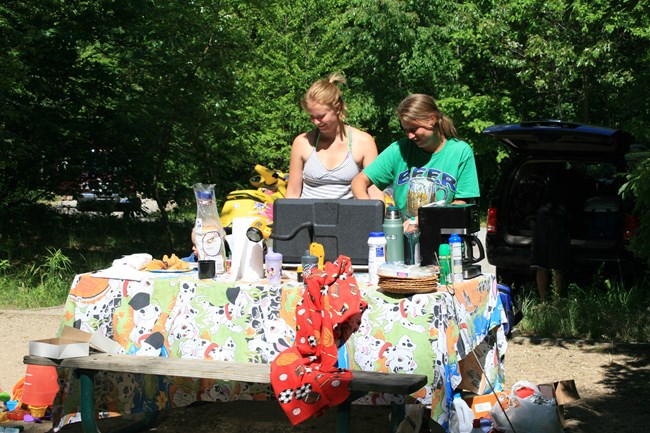 Family preparing breakfast at the Dunewood Campground