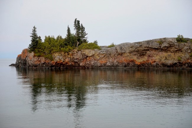 Scoville Point, a rock outcropping in the water at twilight