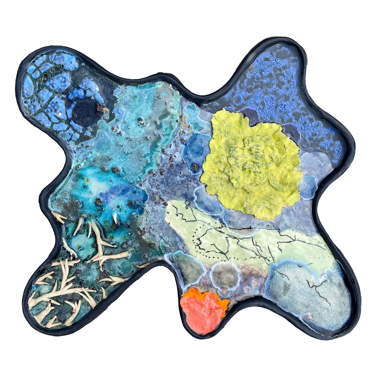 ceramic piece that has elements of the land features of Isle Royale, especially trees and water