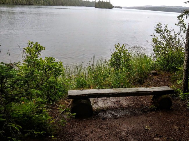 a bench on Tobin Harbor, looking out at the lake