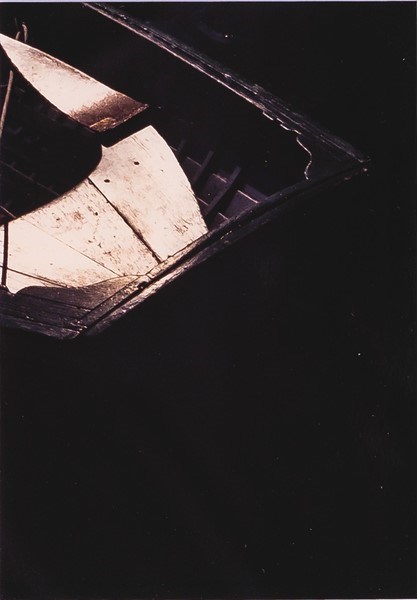 A photograph shows the bow of a small boat