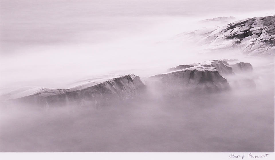 Artwork shows waves over rock in fog