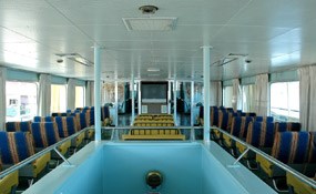 Main Passenger Lounge of the Ranger III, showing central staircase and seating port, center, and starboard.