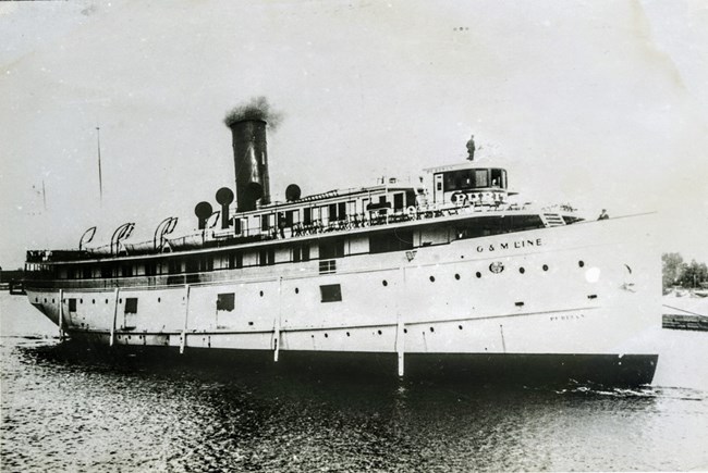 early view of the SS Puritan with the word 'Puritan' with large letters painted on the wheelhouse