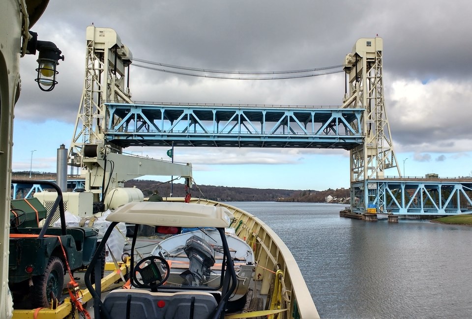 Ranger III ferry carrying cargo while approaching a lift-bridge