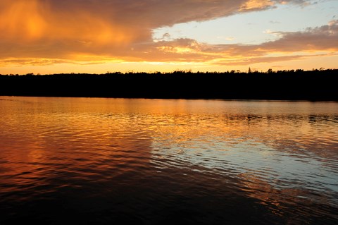 Sunset An orange sunset reflects off the lake surface.