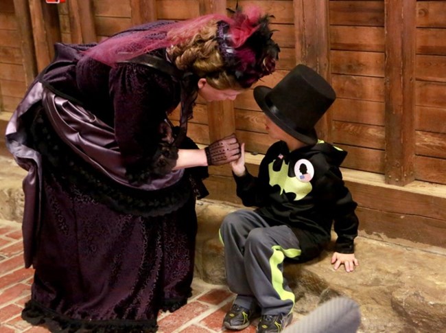 Mrs Garfield with a young visitor.