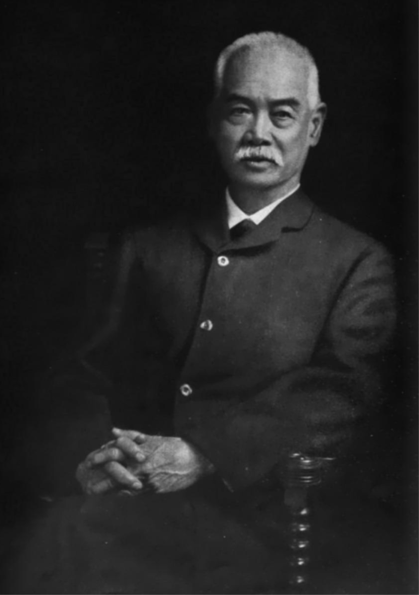 Yung Wing a chinese man sitting in a chair with hands folded in his lap