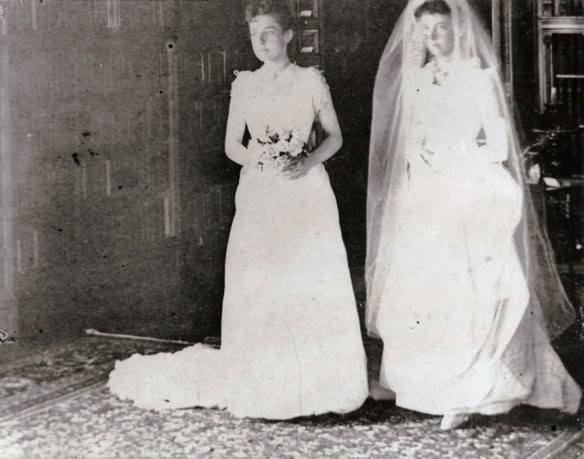 brides-mollie-garfieldand-belle-mason two brides standing next to each other holding flowers